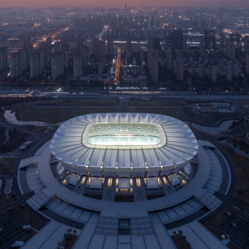 GMP Architekten uses ring of bridges and ramps to connect Chinese stadium to parkland site
