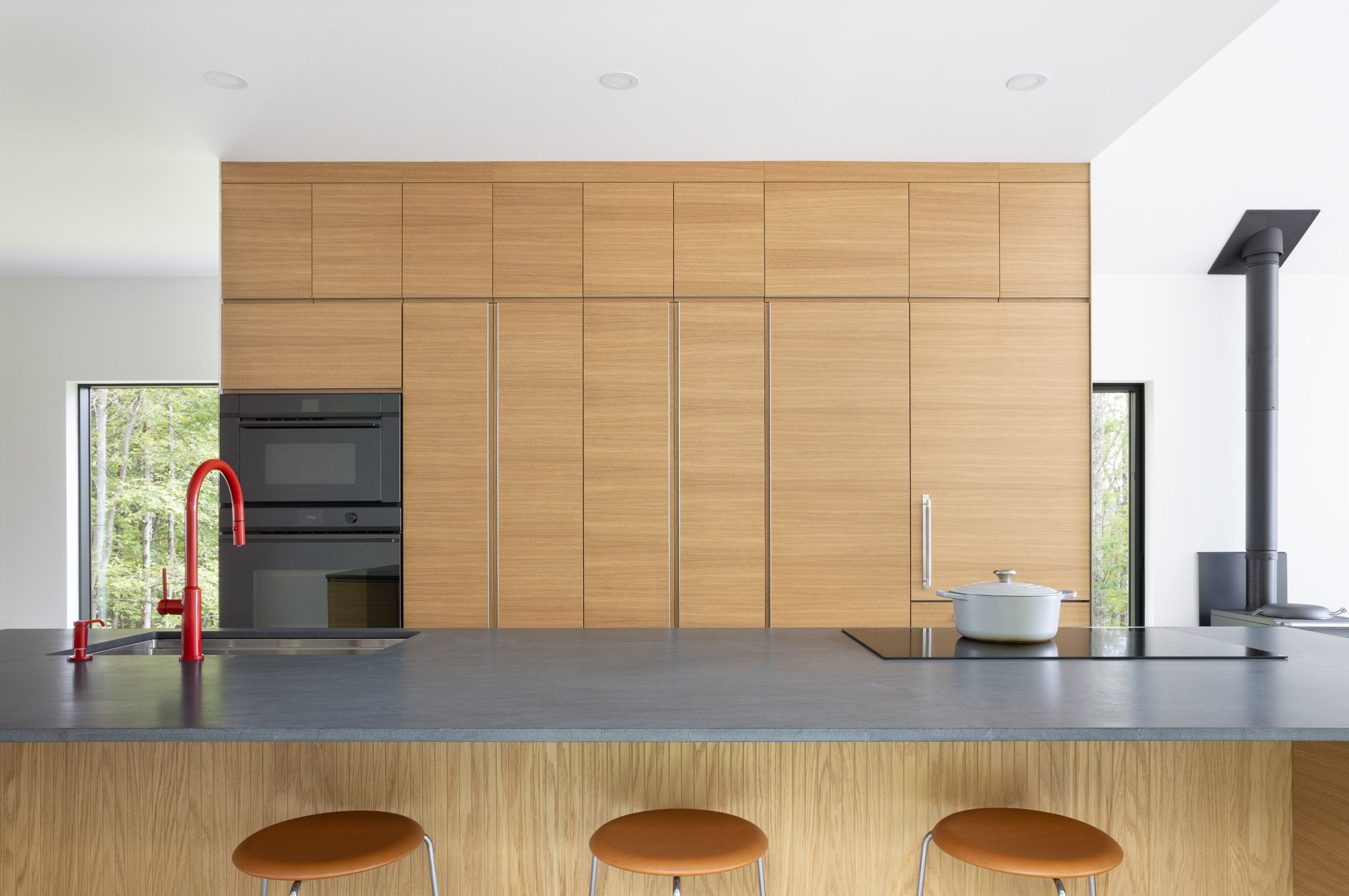 Bare metal and warm white oak interiors