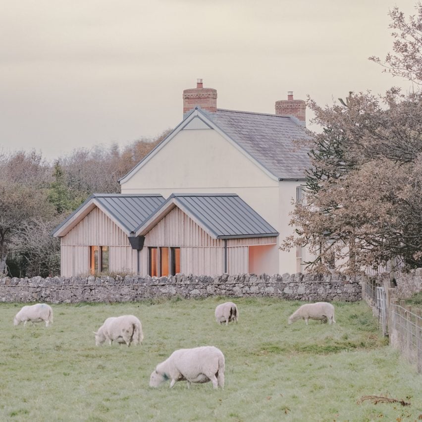 Rural Office bookends Delfyd Farmhouse in Wales with larch-clad extensions