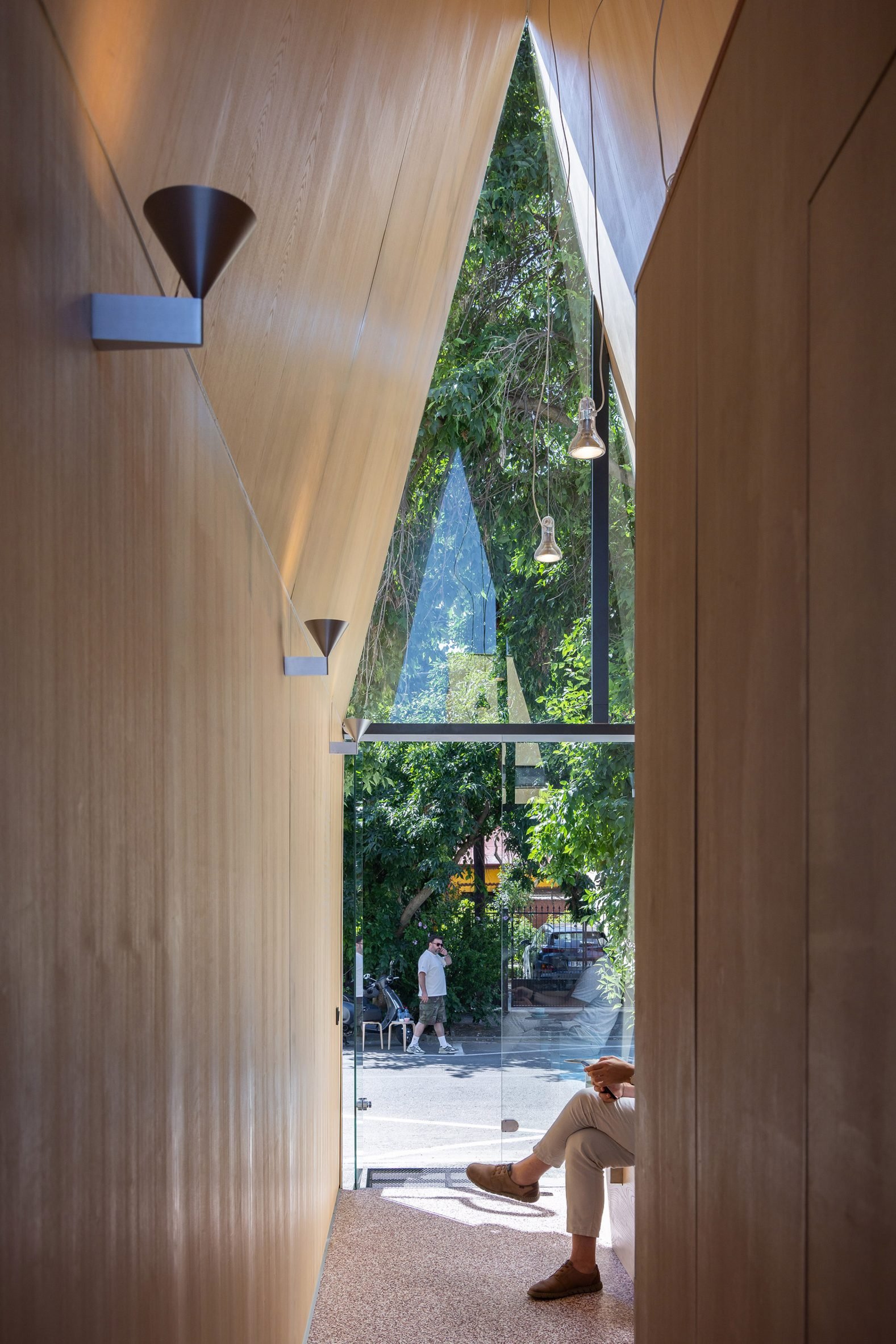 Wooden interior of pitched cafe by Vinklu