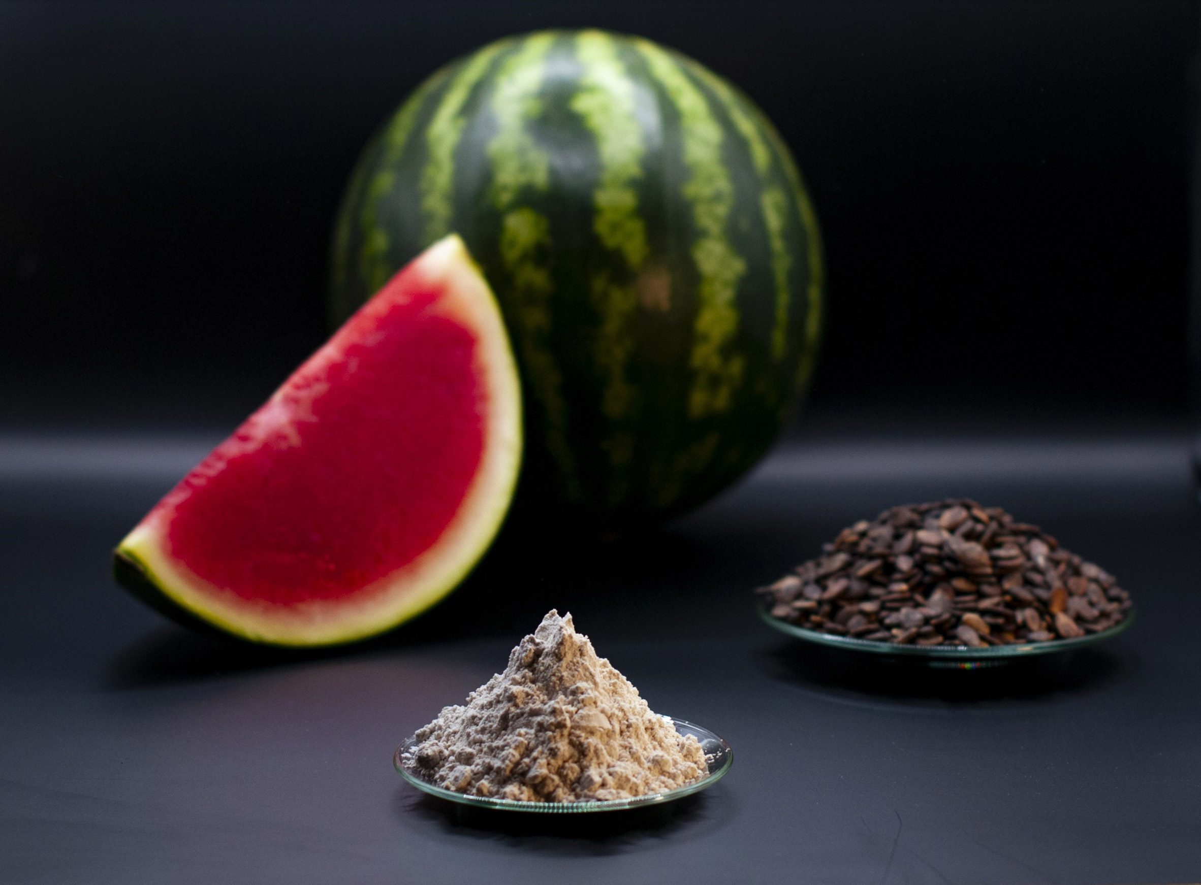 Watermelon, sawdust and struvite on a table