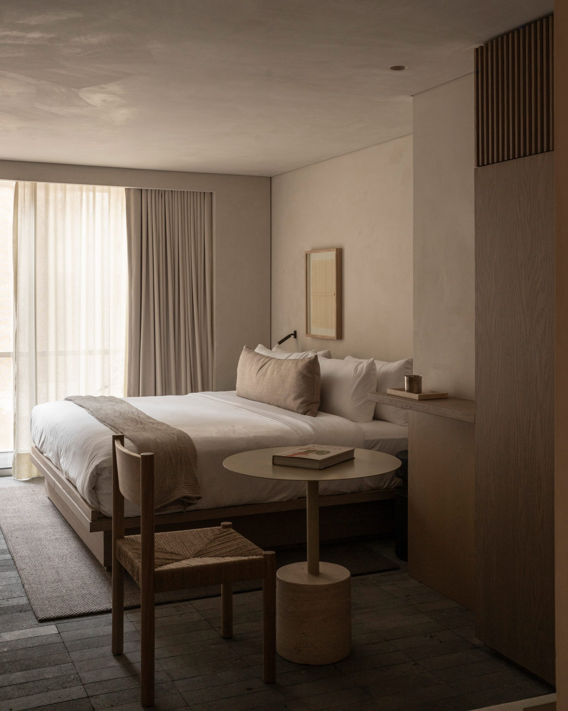 Hotel guest room with neutral-toned interior
