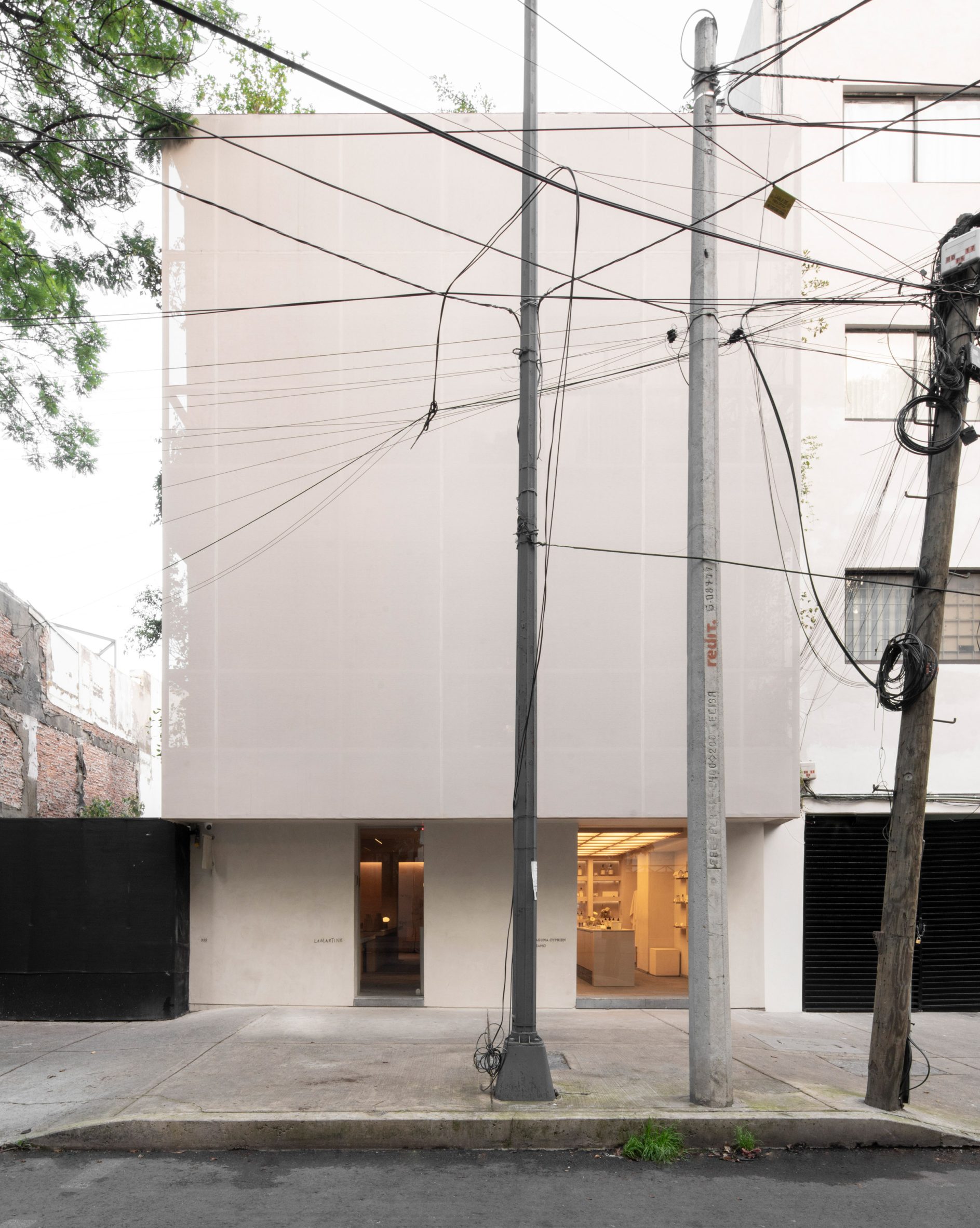 Lamartine hotel's upper level are concealed by a metal-mesh screen