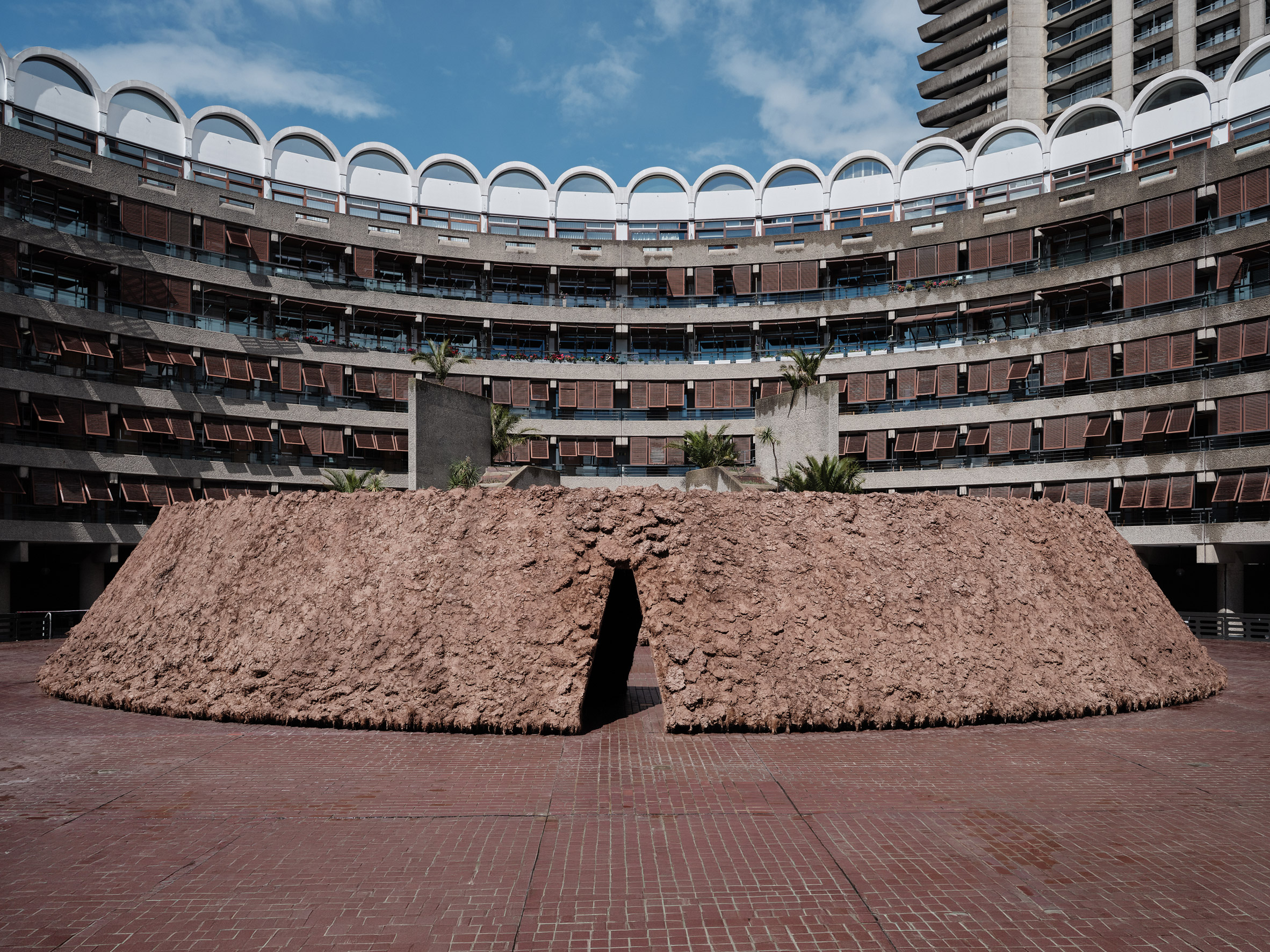 Exterior view of soil sculpture by Delcy Morelos