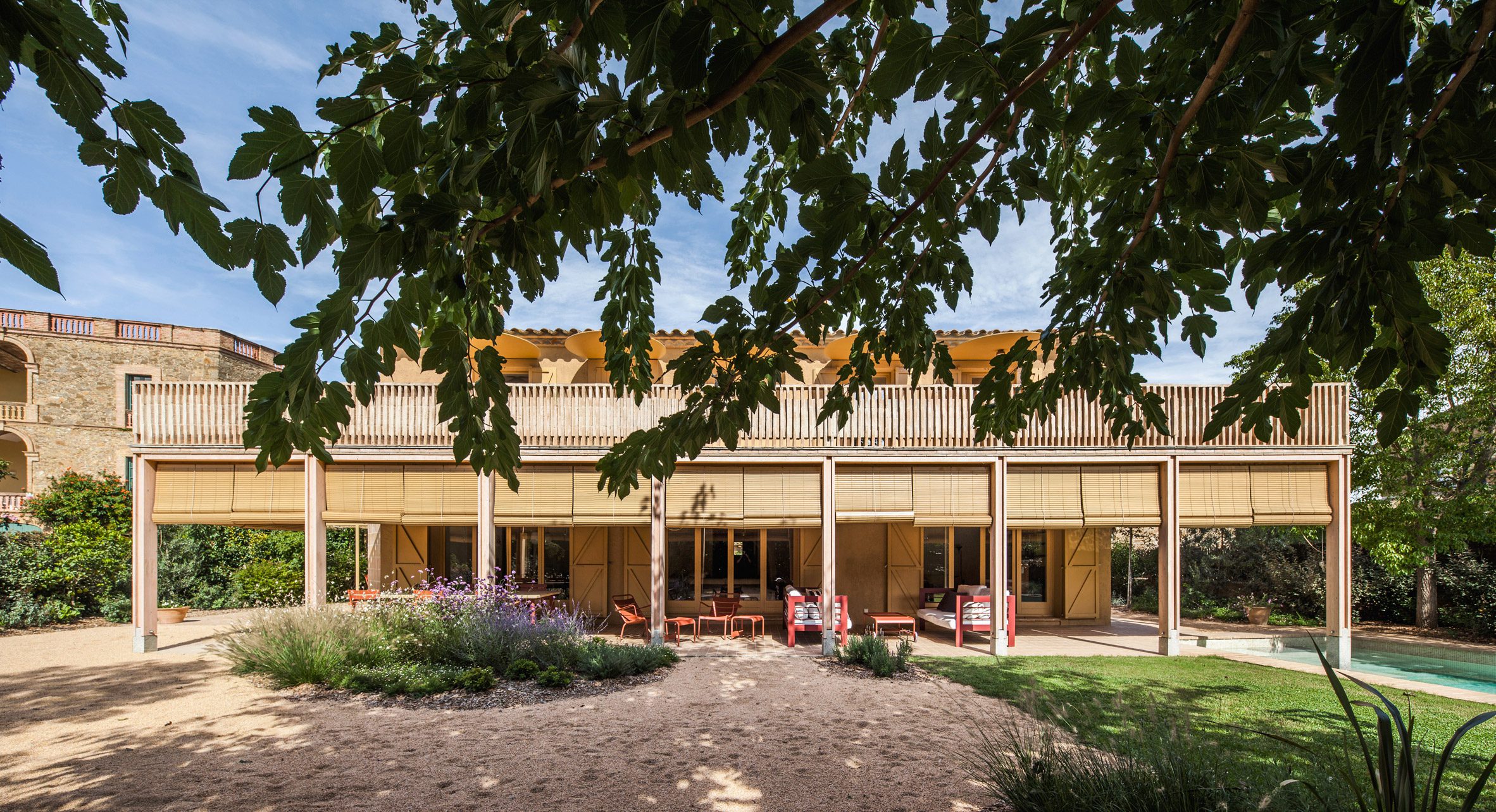Garden elevation showing the extension's porch, terrace and outdoor living spaces