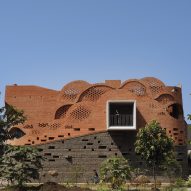 Exterior image of Gadi House and its waved brick facade