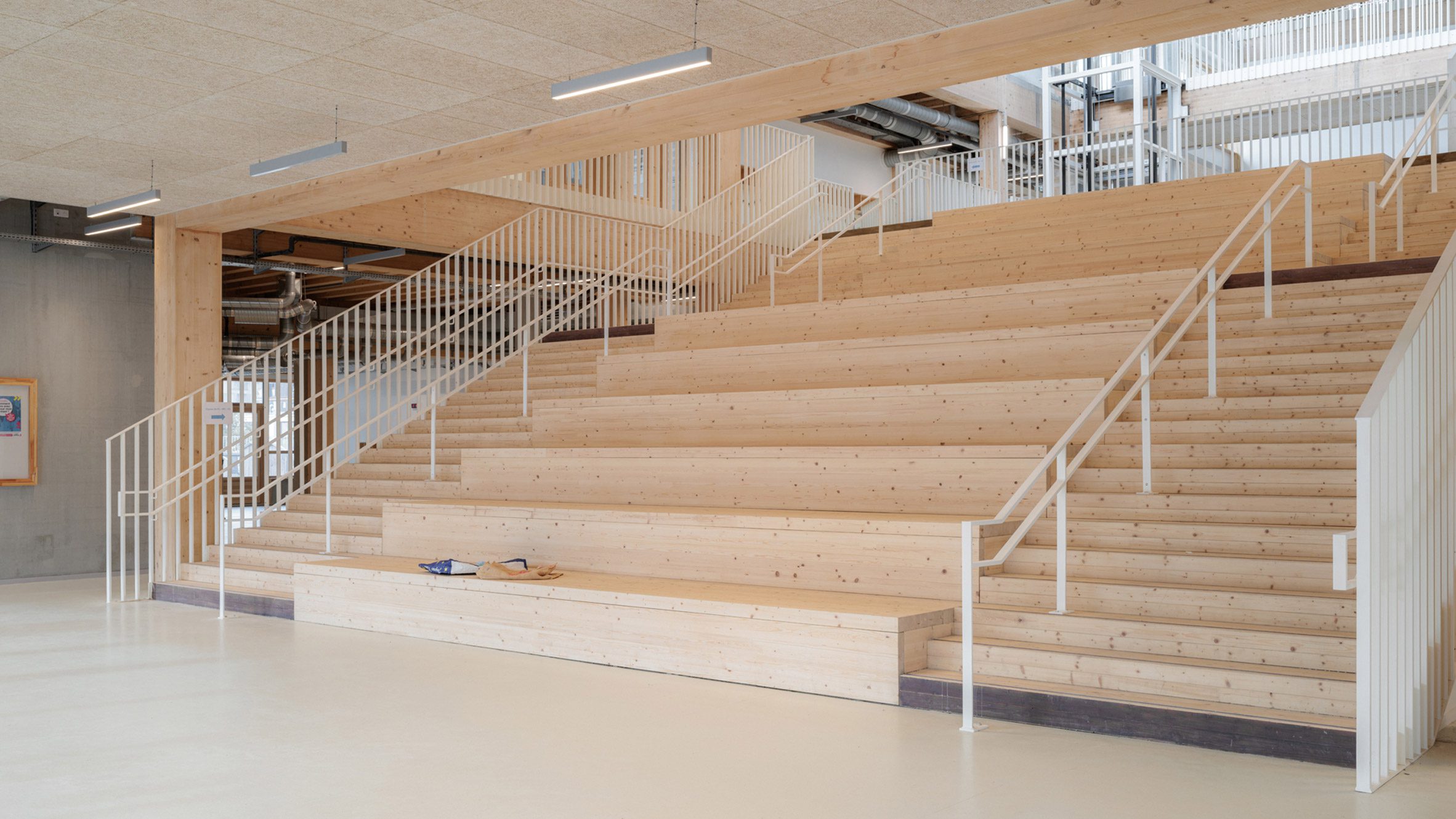 Timber staircase with stepped seating inside the school's central atrium